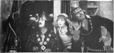 douglas_fairbanks_enid_bennett_and_wallace_beery_listening_to_radio